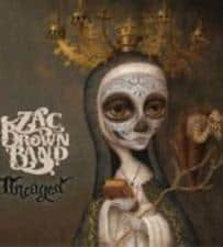 Artwork for ZAC BROWN BAND - UNCAGED (PREOWNED CD) album on vinyl, featuring a stylized female figure with a skeletal face and autumnal tree branch crown.