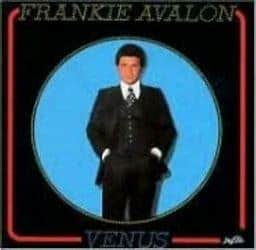 Album cover featuring FRANK AVALON - THE STORY (PREOWNED CD) titled "Venus," with him in a black suit, centered inside a blue circular frame on a vinyl record background.