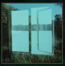 A reflective glass door standing open in a grassy field, offering a clear view of a tranquil, tree-lined lake in the background, resembling a scene from the WAKE - CONFLUENCE (VINYL LP) cover.