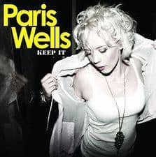 Album cover for PARIS WELLS - KEEP IT (PREOWNED CD), featuring the artist in a white jacket, looking downwards with a necklace, against a black background with yellow text. This rare and collectable vinyl edition is
