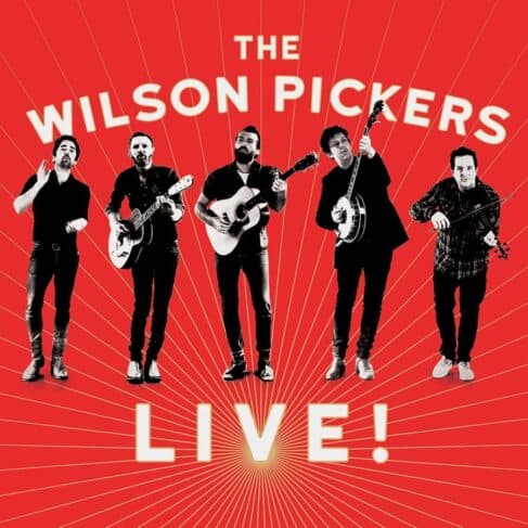 Promotional poster for the WILSON PICKERS - LIVE! (VINYL LP) band, featuring five members with instruments on a red background with radiating lines and the text "the WILSON PICKERS - LIVE! (VINYL LP) Album!